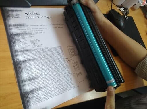 Các lỗi máy in thường gặp, Bản in bị lem mực một bên